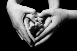 newborn-babies-feet-in-parents-hands